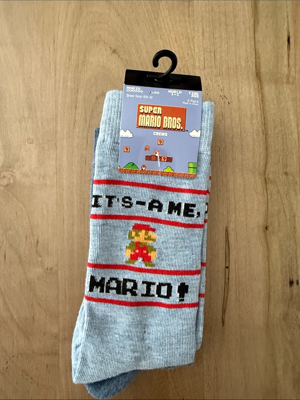 Nintendo Light Blue Crew Socks with Red and Yellow Mario Pixel Art